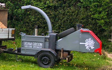 Adam gibson treecare specialist with Wood chipper at Greatham
