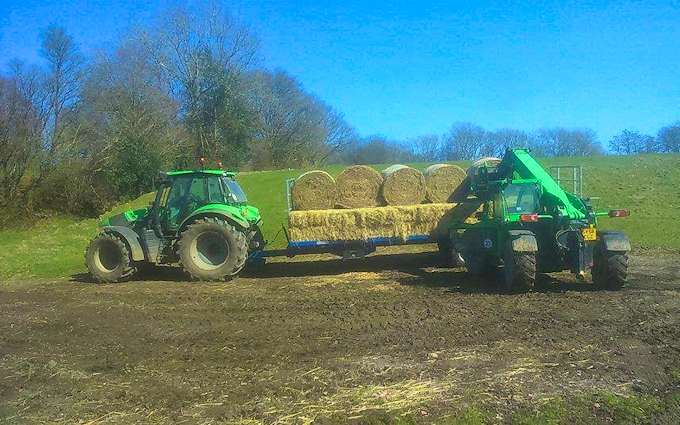 Belsham farming with Flat trailer at United Kingdom