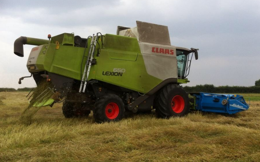 Girsby farm services ltd with Combine harvester at Girsby Lane
