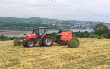 Wildwoods contractors with Round baler at United Kingdom