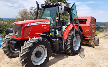 Clarke farming and contracting  with Round baler at United Kingdom