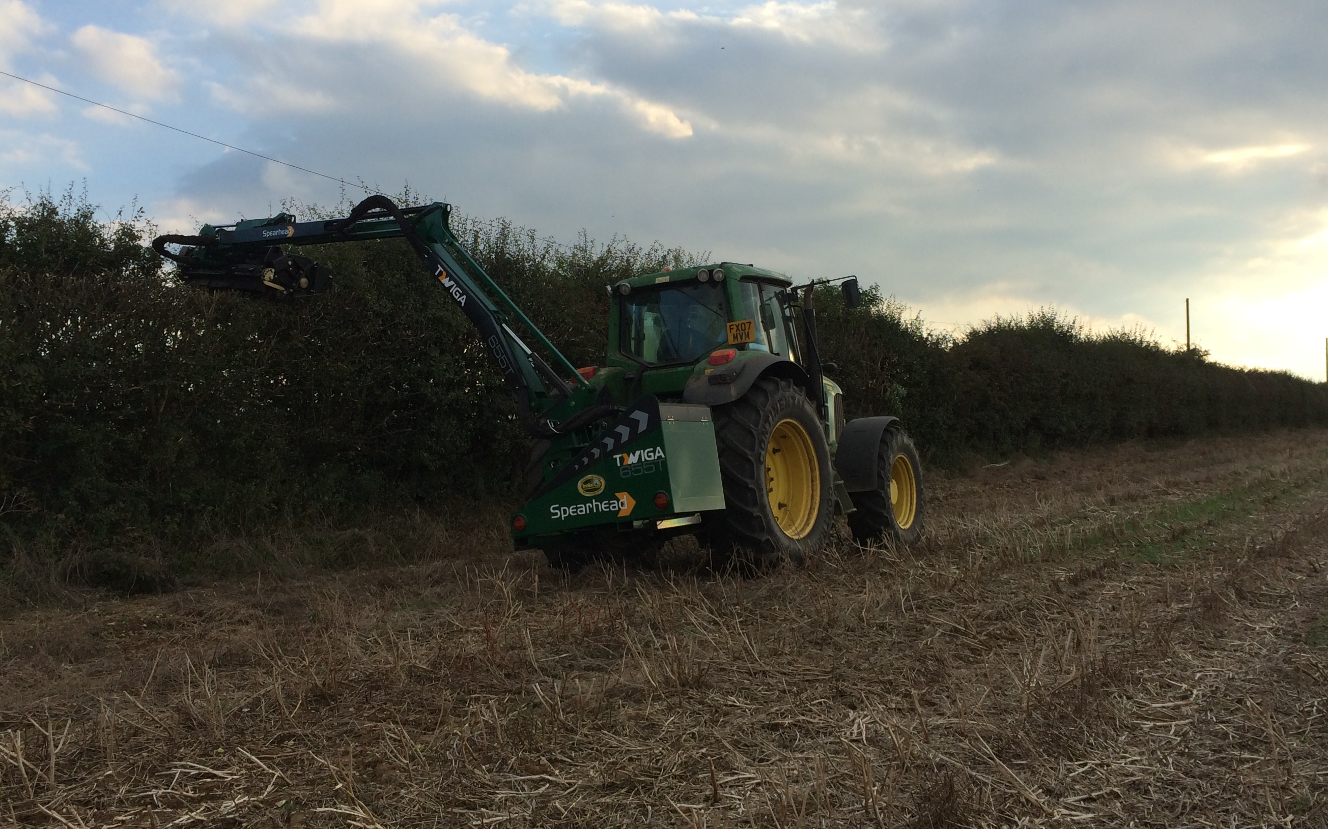 Girsby farm services ltd with Hedge cutter at Girsby Lane