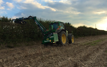 Girsby farm services ltd with Hedge cutter at Girsby Lane