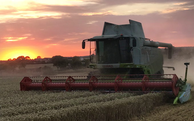James knight farms with Combine harvester at United Kingdom