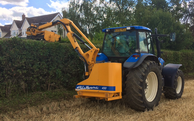 T wasteney  with Hedge cutter at United Kingdom