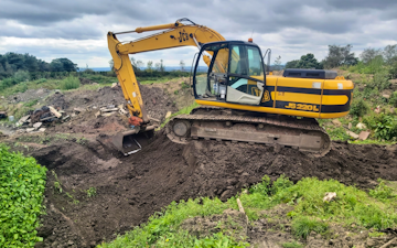 Earthworx recycling ltd with Excavator at United Kingdom