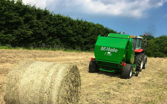 Spencer & sons agricultural services with Round baler at Totnes