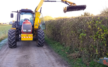 A.j.turney contracting with Hedge cutter at Bletchley