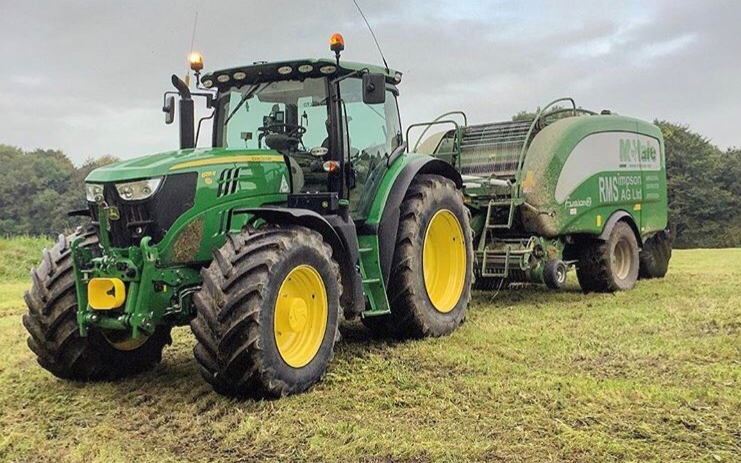 R.m simpson agriculture ltd with Round baler at Hunsworth Lane