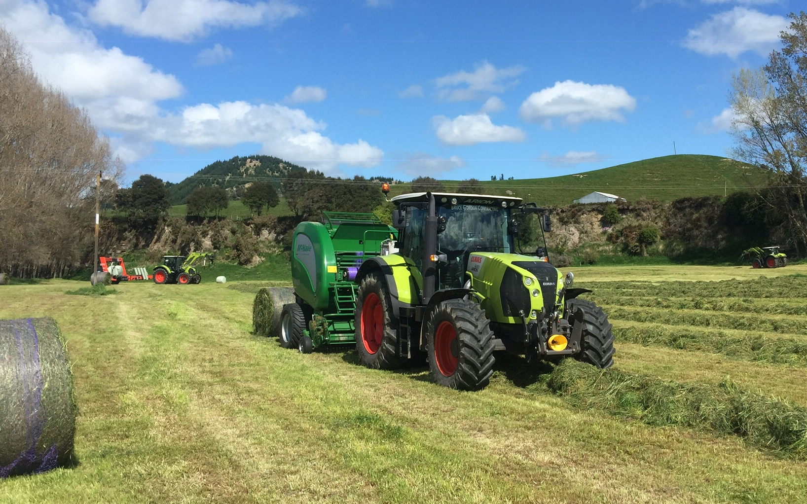 Bruce gordon contracting  with Round baler at Marton