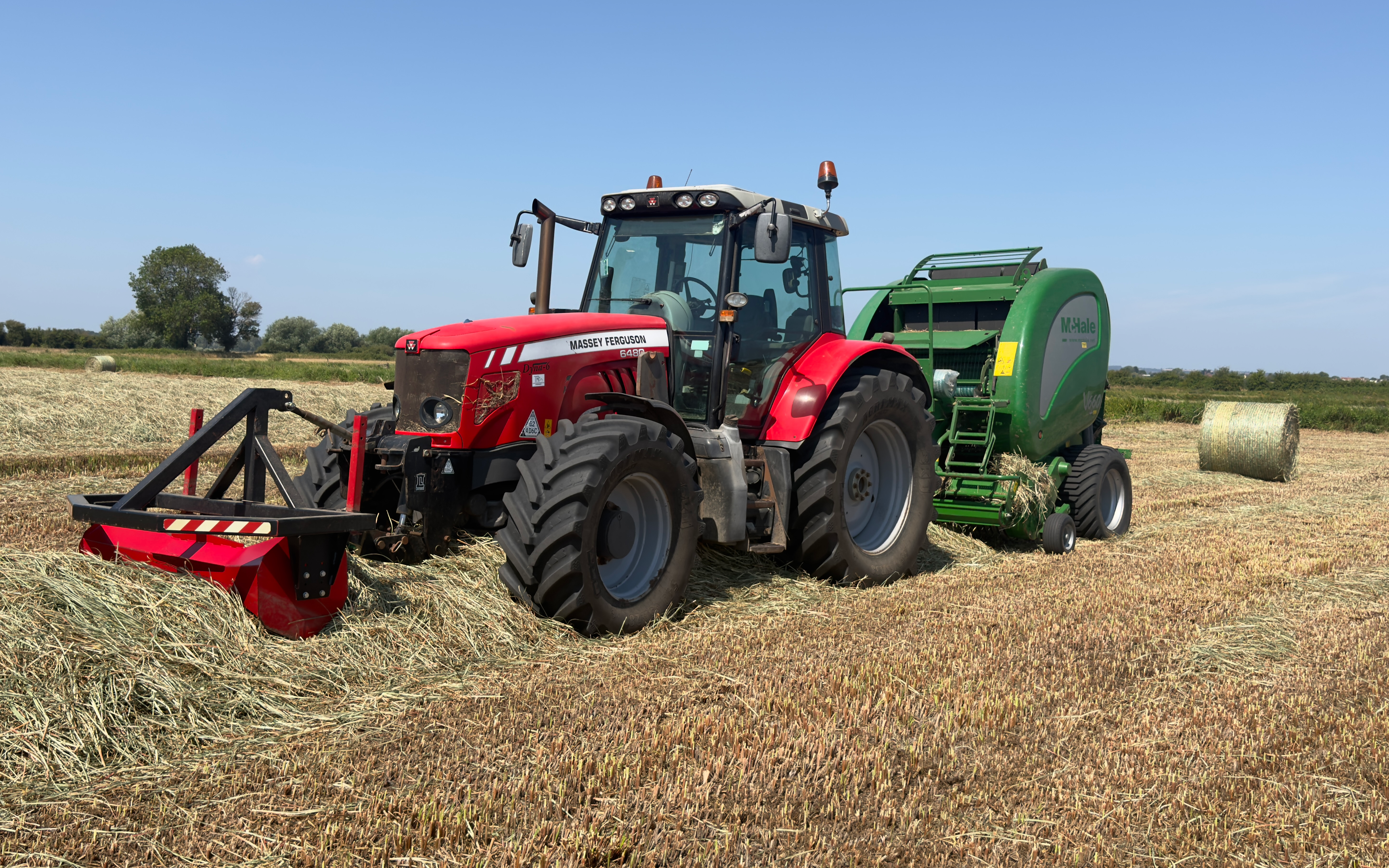 Jw agricultural services  with Round baler at Curry Rivel