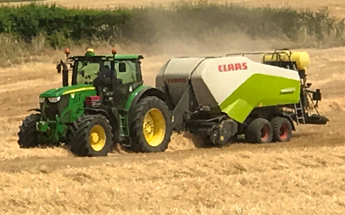 David marshall agricultural contractor with Large square baler at Albrighton