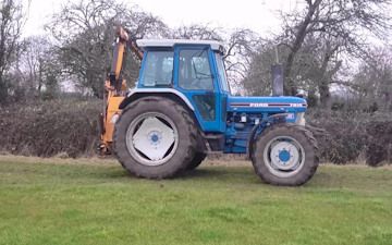T.j saunders contracting with Hedge cutter at Upton Saint Leonards