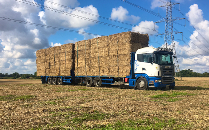 Norfolk straw products ltd with Large square baler at United Kingdom