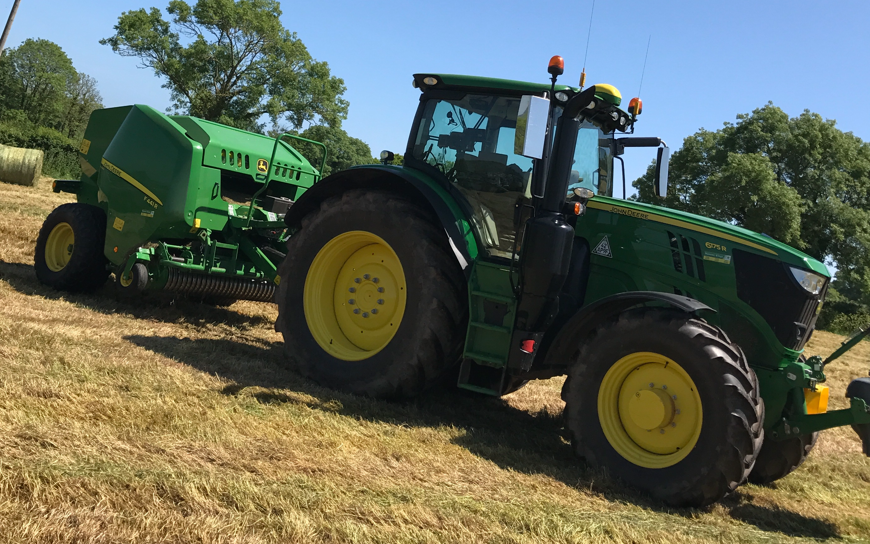 Wildwoods contractors with Round baler at United Kingdom