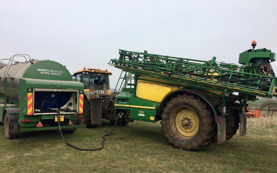 H c beales and co with Trailed sprayer at Great Ellingham