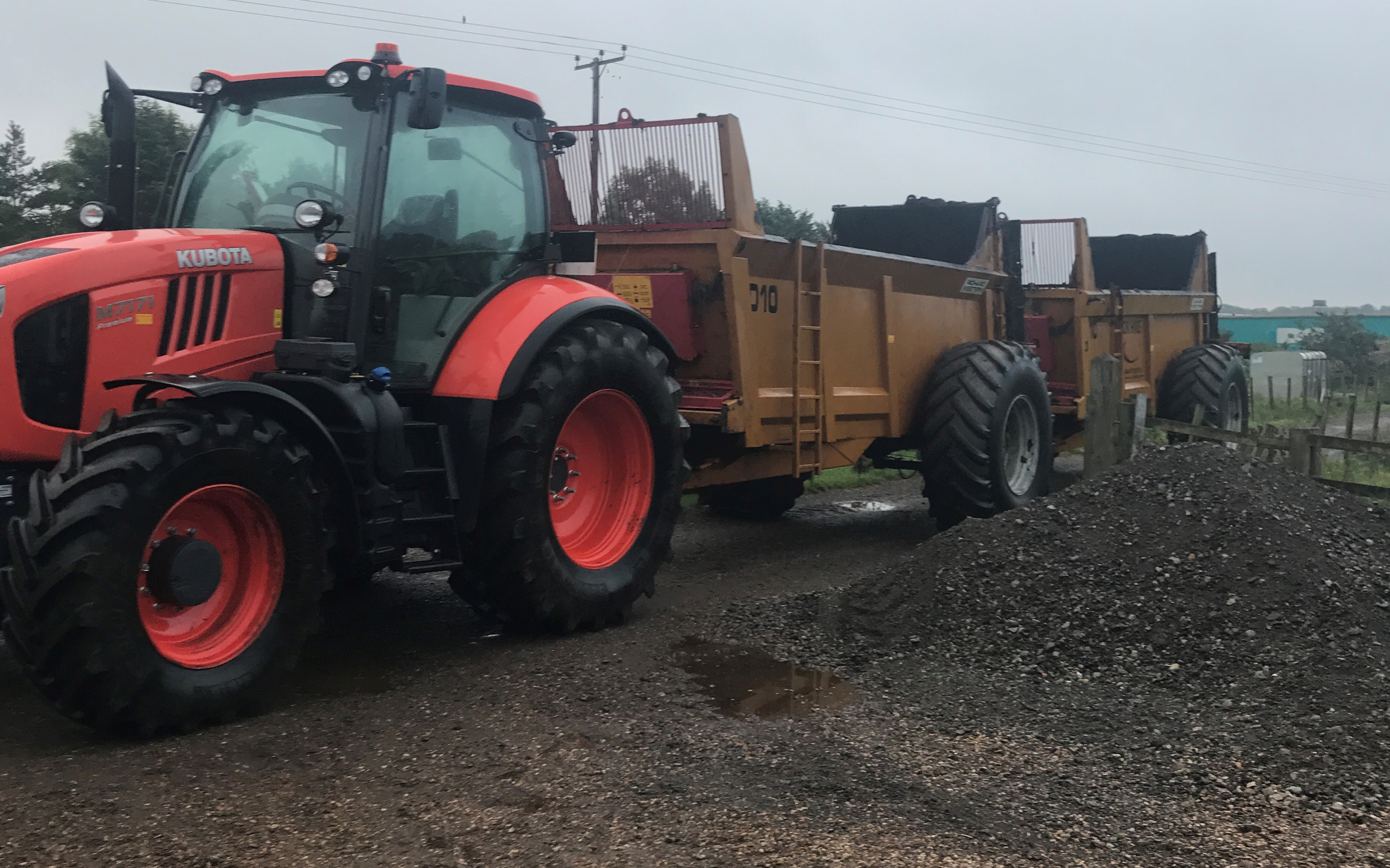 Jr king and son with Manure/waste spreader at United Kingdom