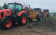Jr king and son with Manure/waste spreader at United Kingdom
