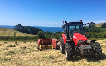 Spencer & sons agricultural services with Small square baler at Totnes