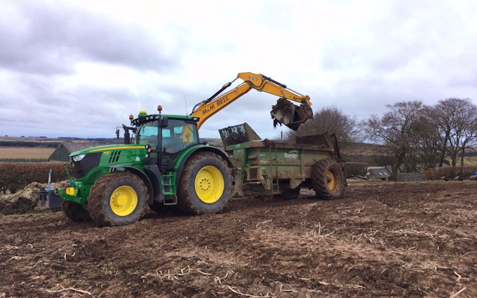 M & m bell contractors with Manure/waste spreader at United Kingdom
