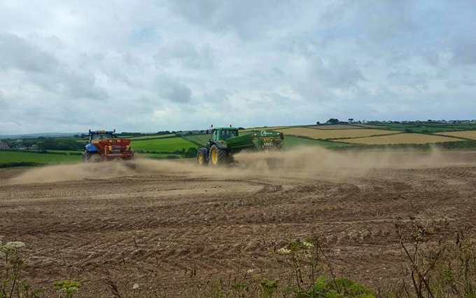Dan hirst agricultural contractors  with Lime spreader at United Kingdom