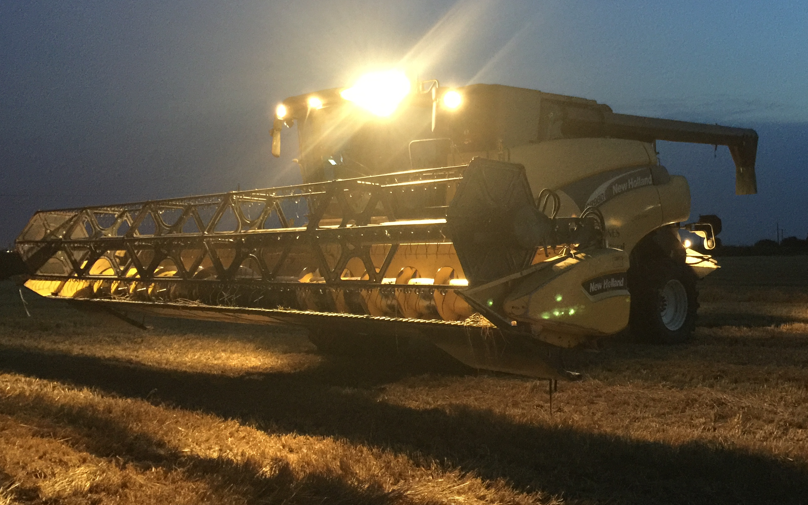 A jones agricultural services  with Combine harvester at United Kingdom