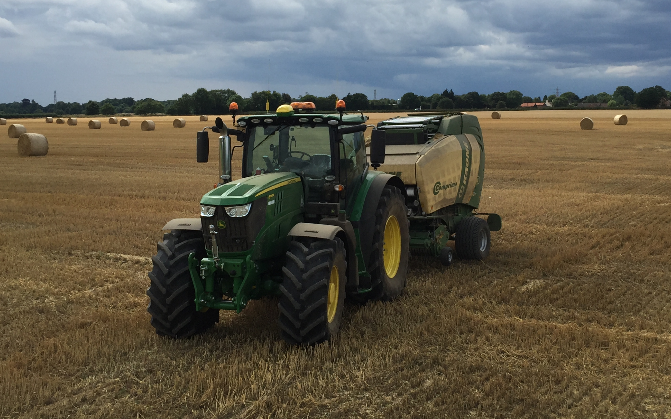 A. farrell contracting with Round baler at Hellington