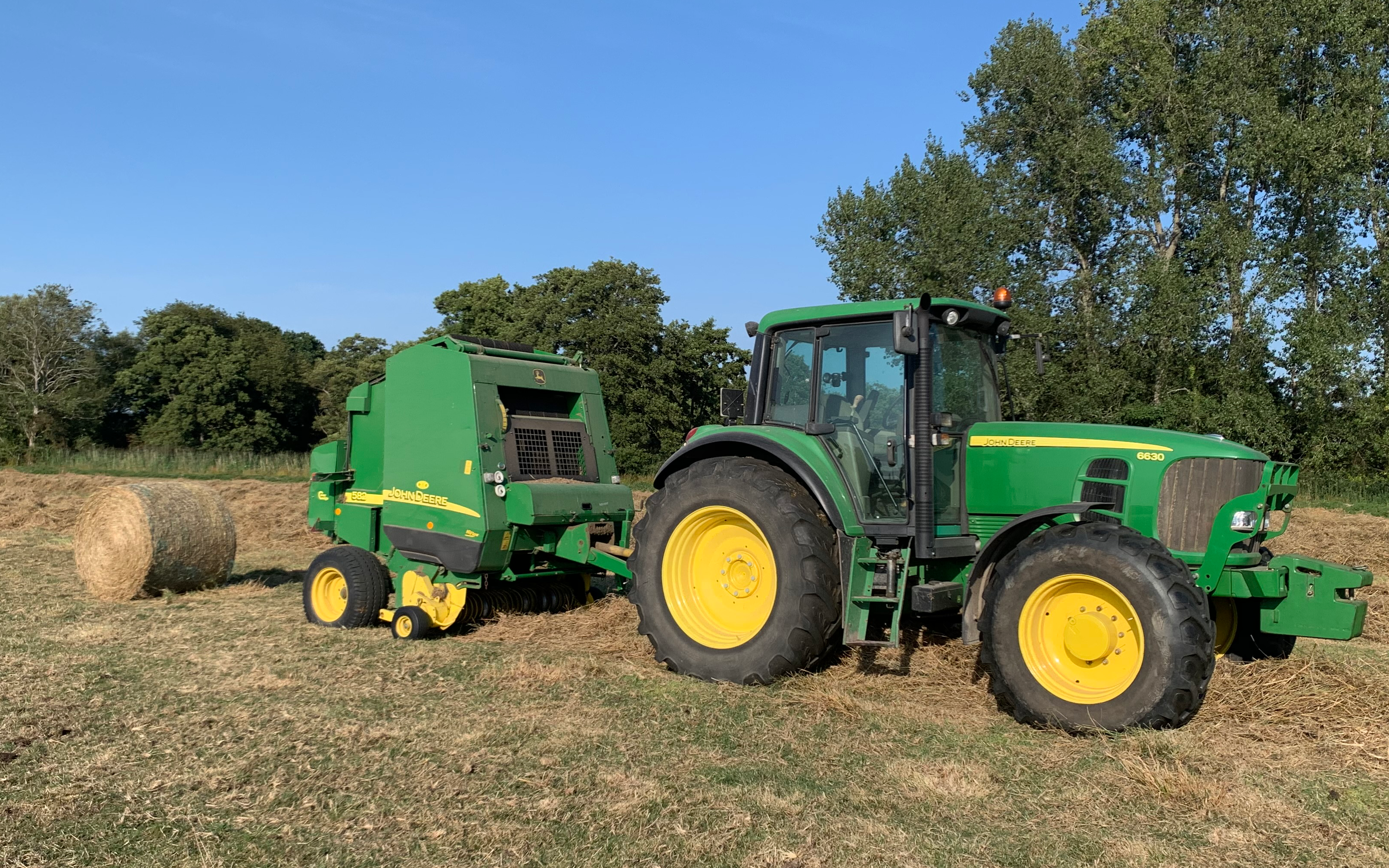 A c harris contracting  with Round baler at Kingston Seymour