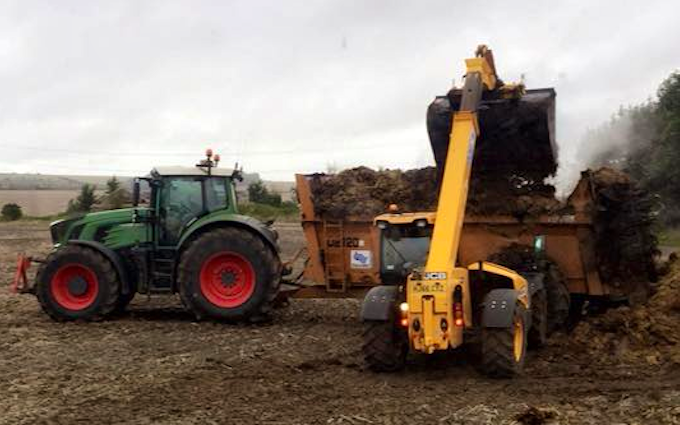 A t contracting with Manure/waste spreader at Berryfield Lane