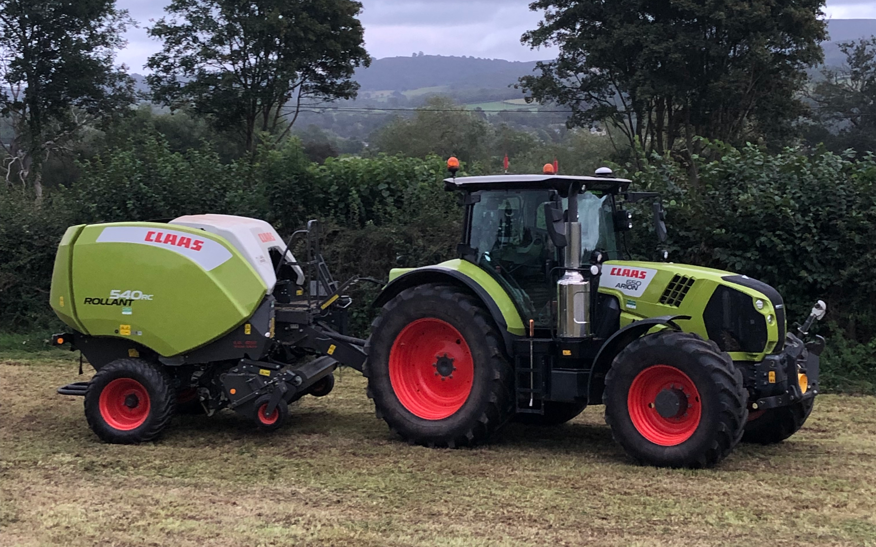 K m bray agri & plant contractor  with Round baler at Talgarth