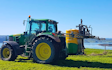 Cathcart contracting ltd  with Tractor-mounted sprayer at Waikokowai