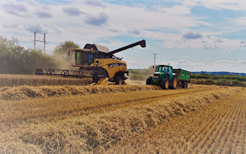 Oakfield contracting with Combine harvester at United Kingdom