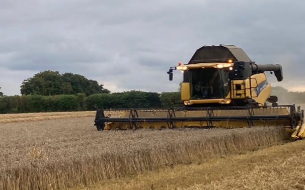 A jones agricultural services  with Combine harvester at United Kingdom