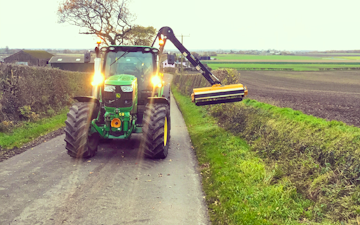 S.t.anderton agricultural contracting  with Hedge cutter at Chorley