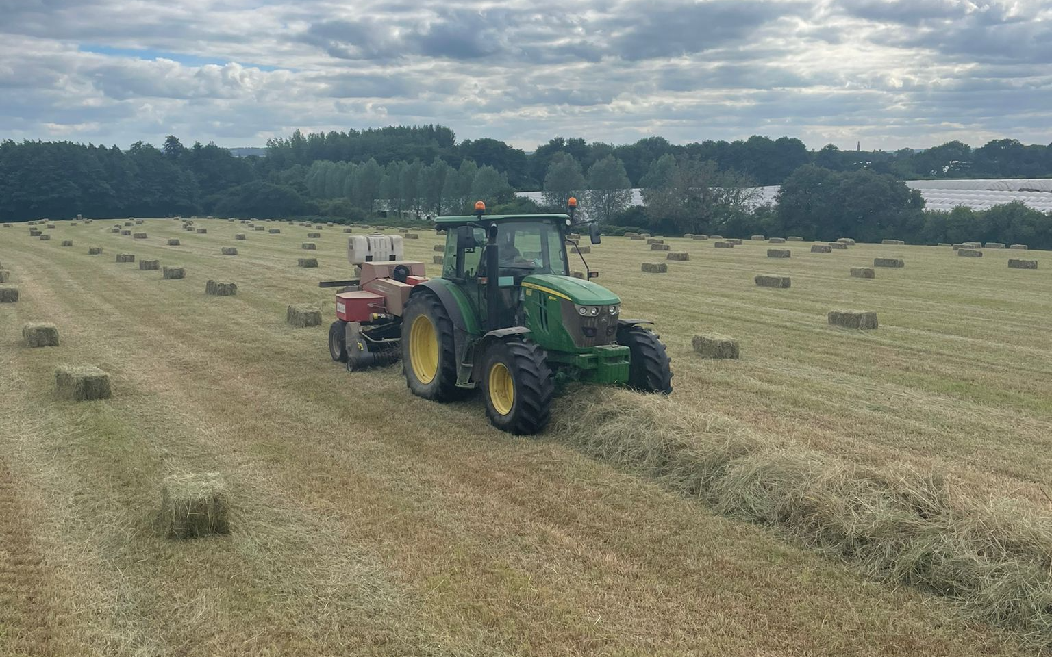 Belsham farming with Small square baler at United Kingdom