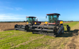 Maugers rural contracting  with Windrower at Rolleston