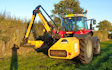 Jds agricultural contracting with Hedge cutter at United Kingdom