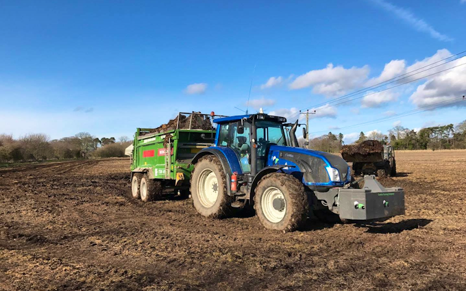 Cowton farming company  with Manure/waste spreader at North Cowton