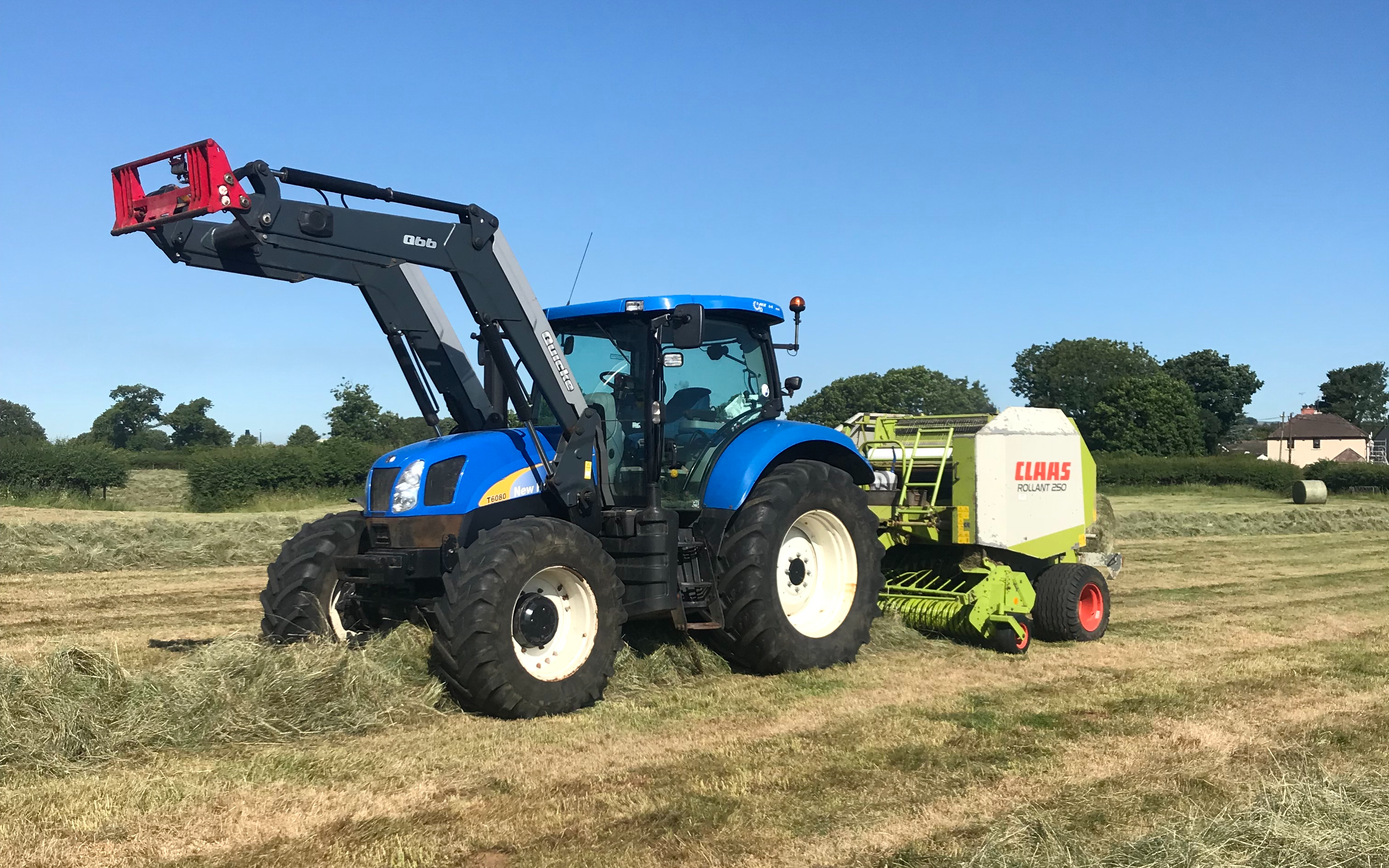 Scott walton contracting  with Round baler at United Kingdom