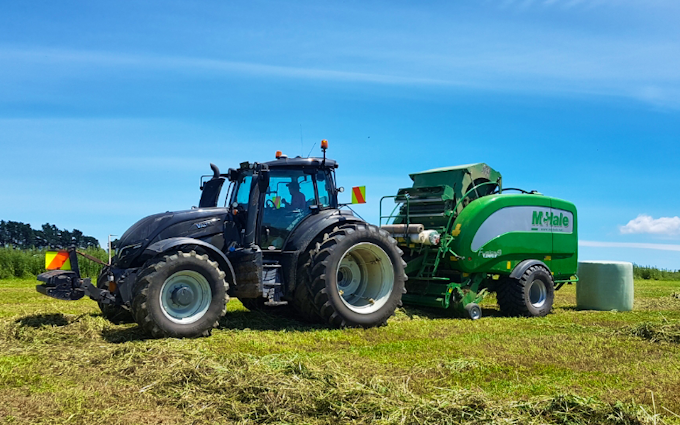Three rivers contracting  with Round baler at Wyndham