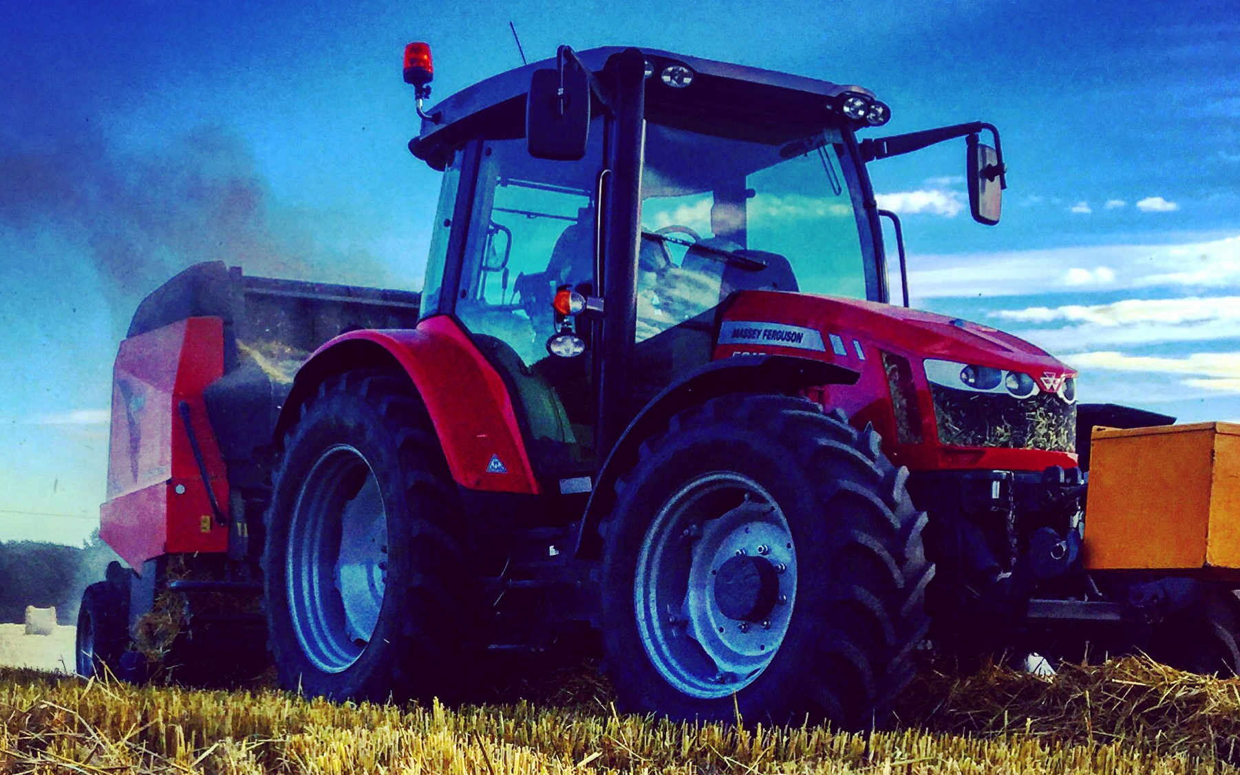 Steve woodward ltd with Round baler at Bradley Green