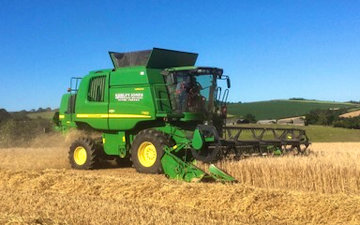 Ashley jones agricultural services  with Combine harvester at Pillaton
