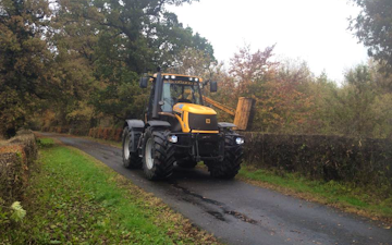 J. steel contracting  with Hedge cutter at Cauldhame Farm Road