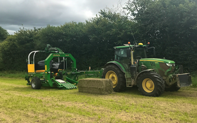 John clements contracting ltd with Large square baler at Camomile Way