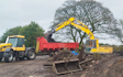 Earthworx recycling ltd with Excavator at United Kingdom