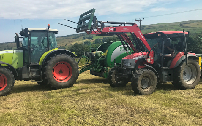 Dan beaumont with Large square baler at United Kingdom