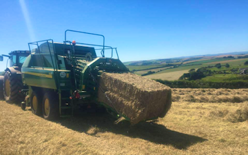Wildwoods contractors with Large square baler at United Kingdom