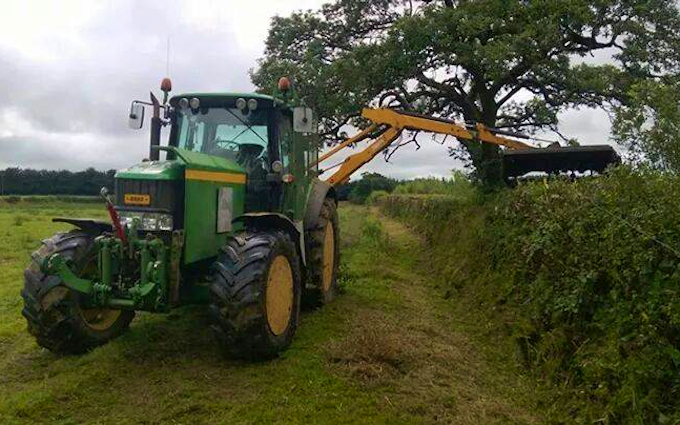 Nick ley contractors  with Hedge cutter at Cookbury