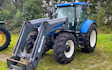 Jysk skov og anlæg med Traktor med frontlæsser ved Asaa