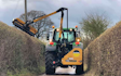 Jon richards contracting  with Hedge cutter at East Hewish